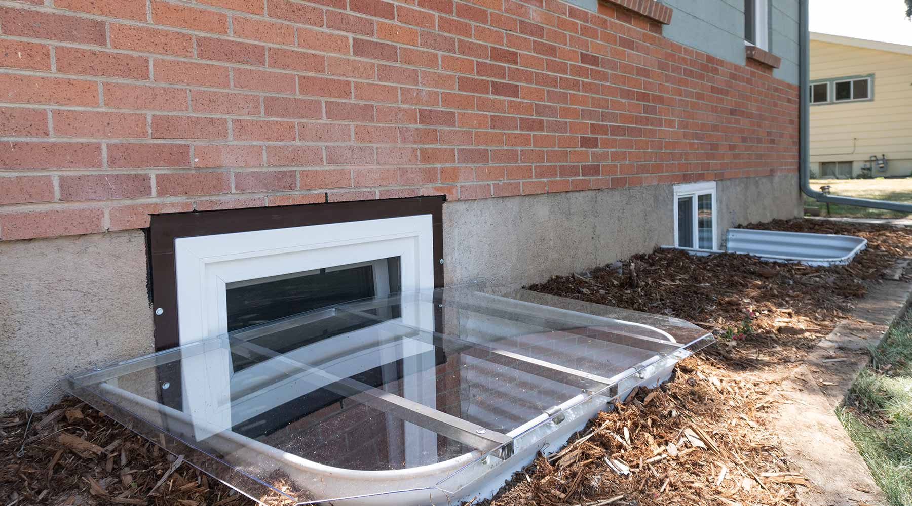 egress window wells with ExoFrame and polycarbonate cover